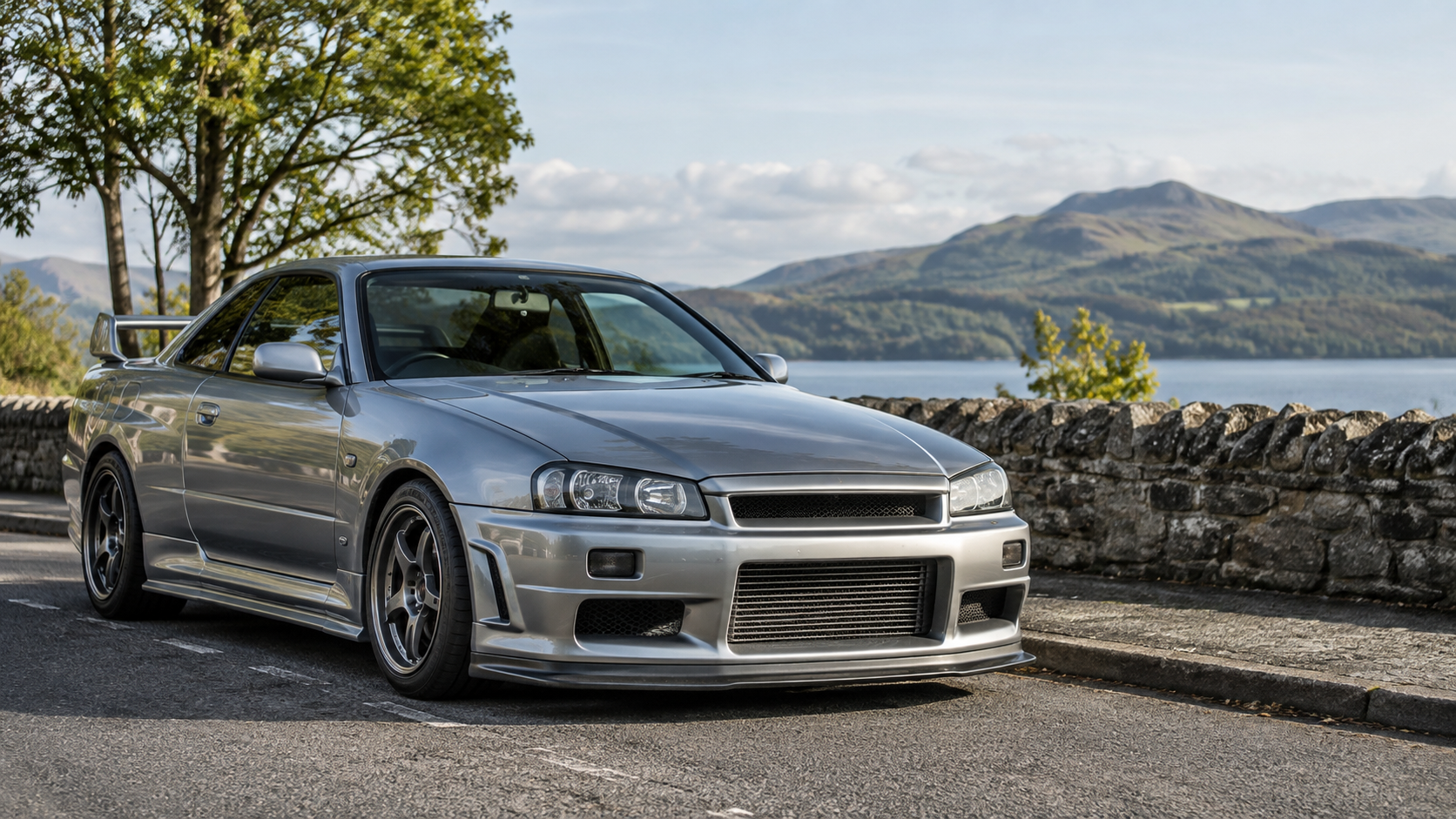 A modified performance car parked in a scenic UK setting